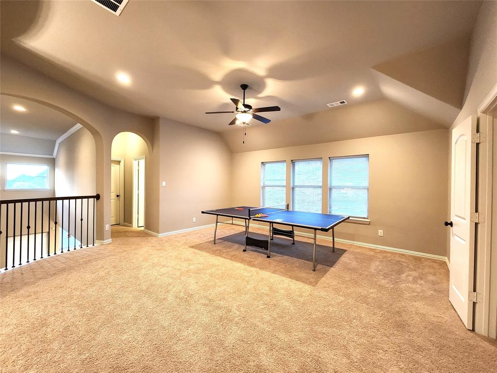 7163 Split Rein Road Frisco, TX 75036 - Photo 26 of 40 a view of a room with furniture and a ceiling fan