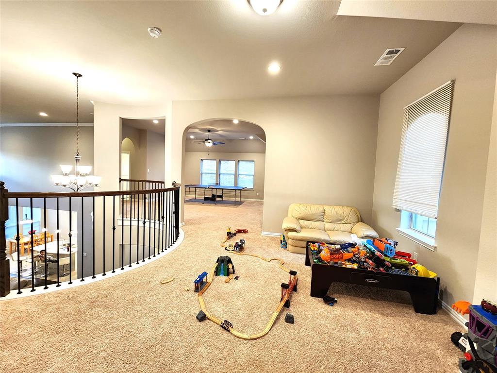 7163 Split Rein Road Frisco, TX 75036 - Photo 27 of 40 a bedroom with furniture and a large window