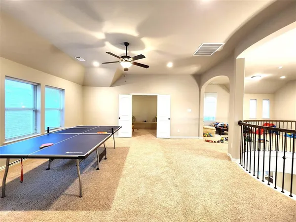 a view of a room with a table and chairs