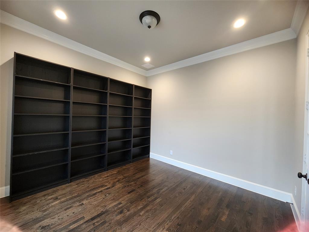 7163 Split Rein Road Frisco, TX 75036 - Photo 29 of 40 a view of an empty room with a wooden floor and a window
