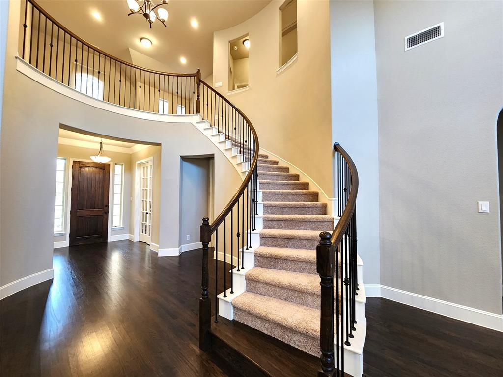 7163 Split Rein Road Frisco, TX 75036 - Photo 8 of 40 a view of staircase with white walls and a window