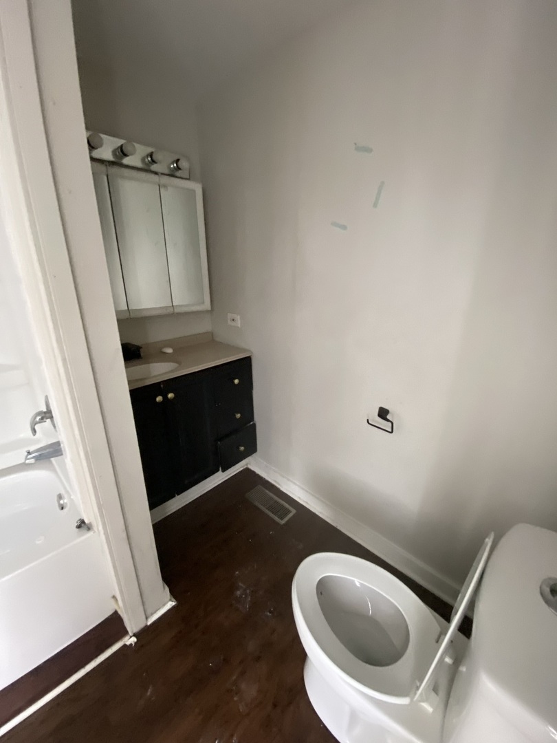 515 Walnut Avenue Elgin, IL 60123 - Photo 12 of 18 a bathroom with a sink and a toilet