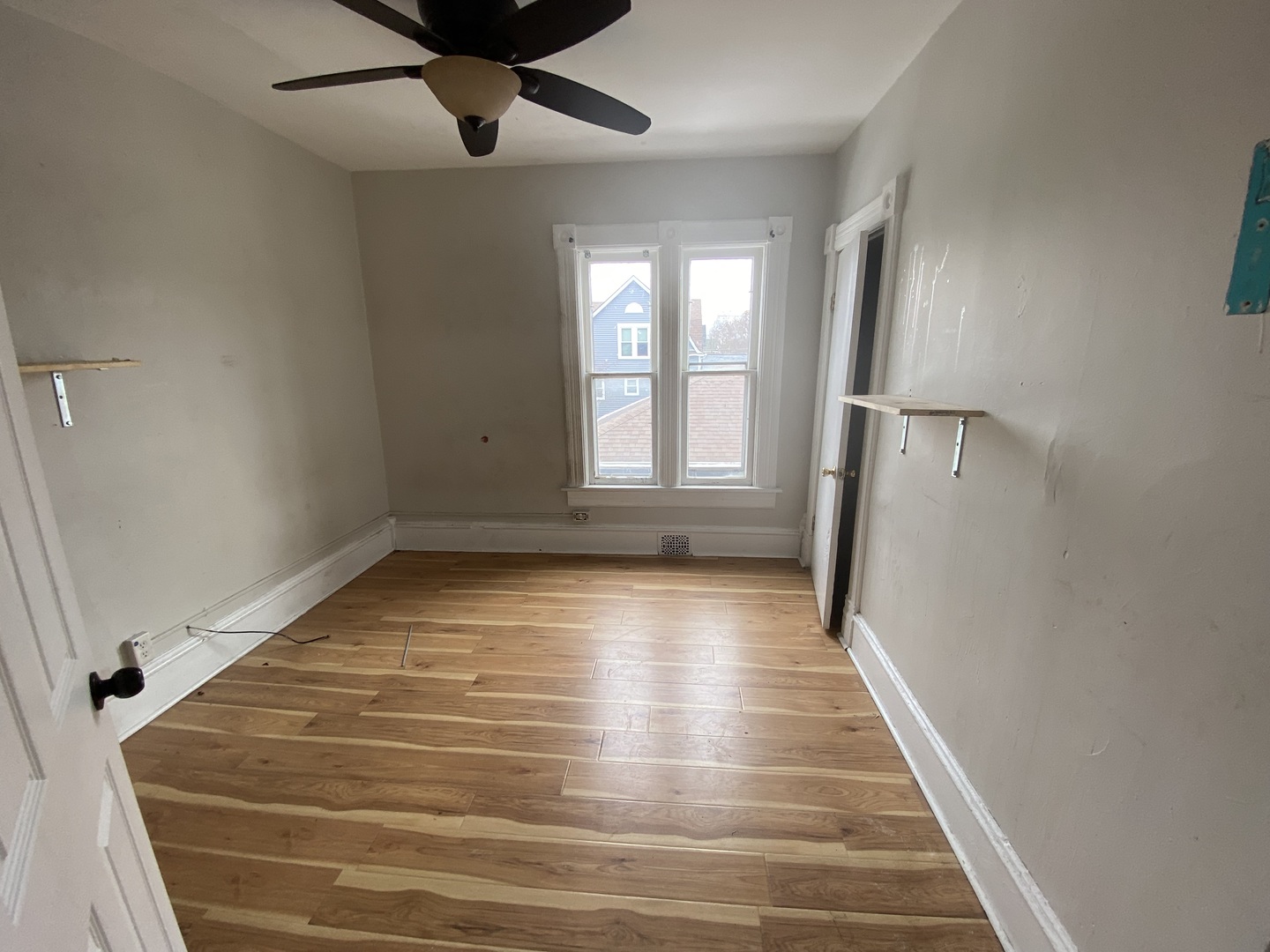 515 Walnut Avenue Elgin, IL 60123 - Photo 15 of 18 wooden floor in an empty room with a window