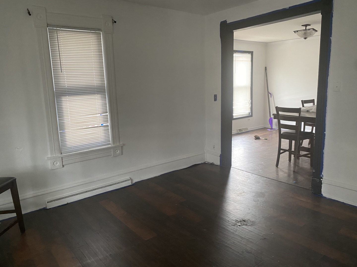 515 Walnut Avenue Elgin, IL 60123 - Photo 4 of 18 an empty room with wooden floor cabinet and windows