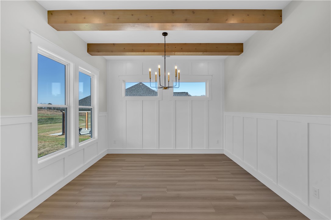 516 Lakeside Drive Anderson, SC 29621 - Photo 20 of 32 Exposed beams and wainscoting add character to this bright and inviting dining space.