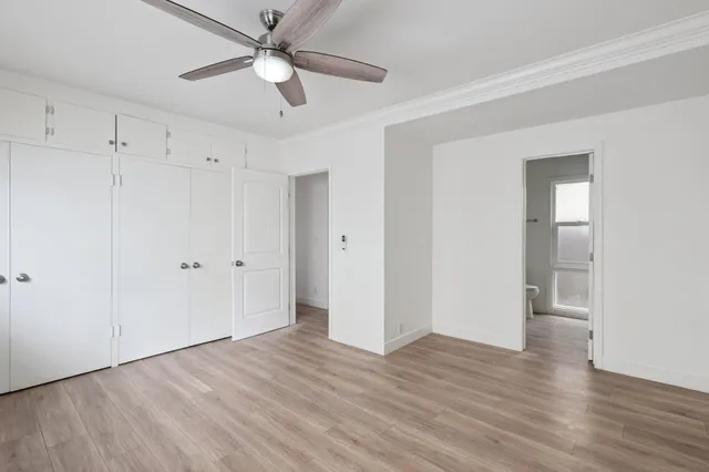 a view of an empty room and wooden floor