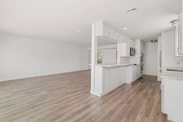 a view of kitchen with wooden floor