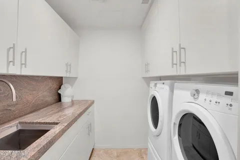 a view of livingroom with washer and dryer