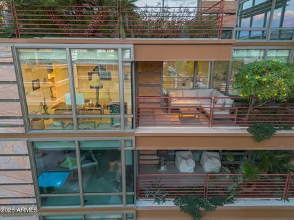 a view of a swimming pool with outdoor seating