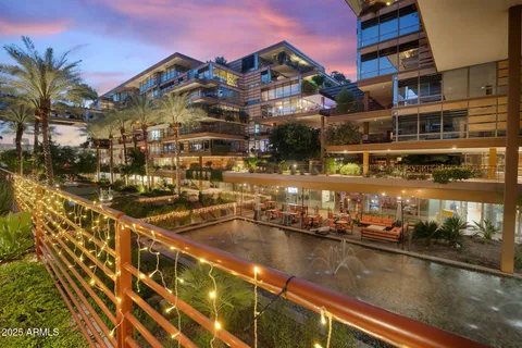 an outdoor space with swimming pool and garden view