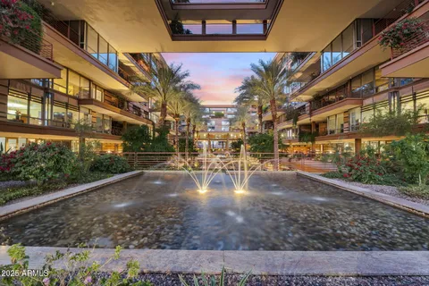 an aerial view of residential houses with city view