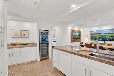 a kitchen with sink stove and cabinets
