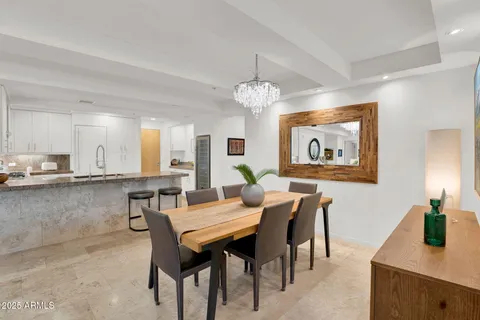 a kitchen with granite countertop a sink and a stove