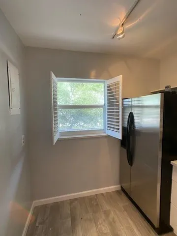 a view of an empty room with a window