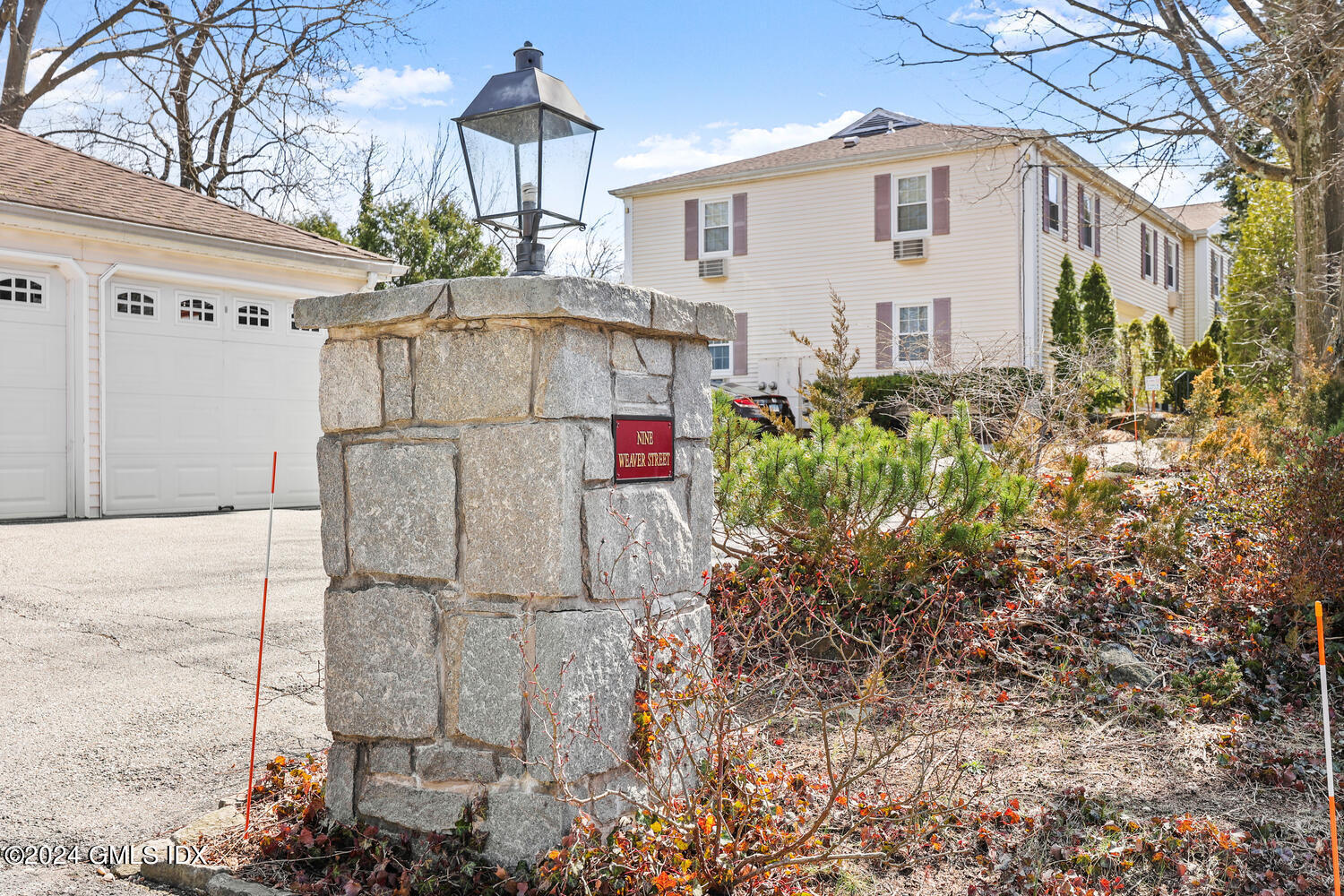 9 Weaver Street, Unit 4 Greenwich, CT 06831 - Photo 28 of 30 a white house with tree in front of it