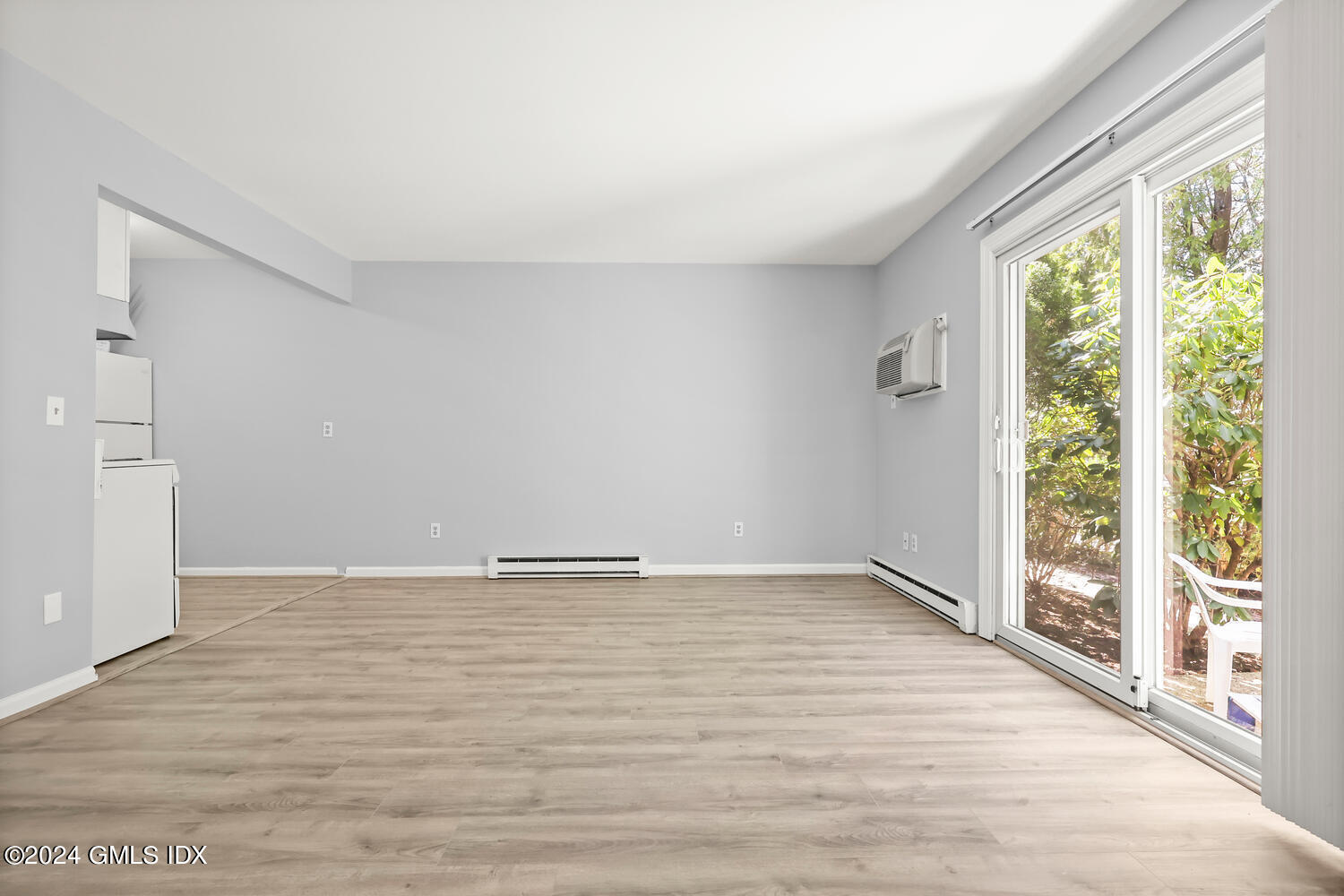 9 Weaver Street, Unit 4 Greenwich, CT 06831 - Photo 5 of 30 wooden floor in an empty room with a window