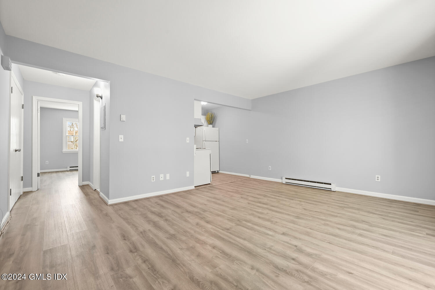 9 Weaver Street, Unit 4 Greenwich, CT 06831 - Photo 7 of 30 a view of an empty room and wooden floor