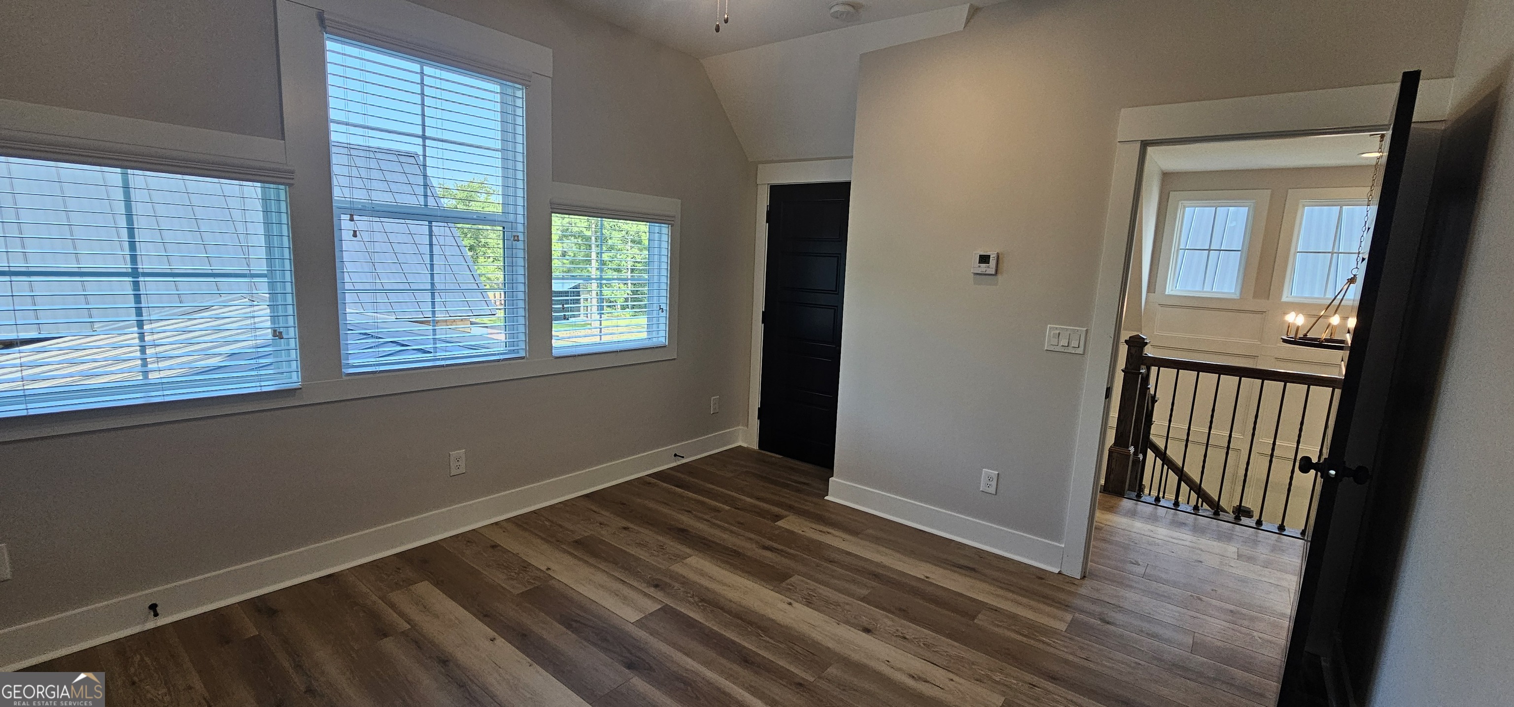 654 Liberty Hill Road Milner, GA 30257 - Photo 105 of 180 a view of a room with wooden floor and windows