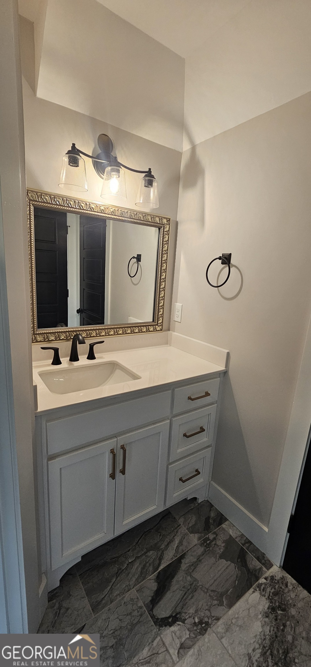 654 Liberty Hill Road Milner, GA 30257 - Photo 109 of 180 a bathroom with a sink and a mirror