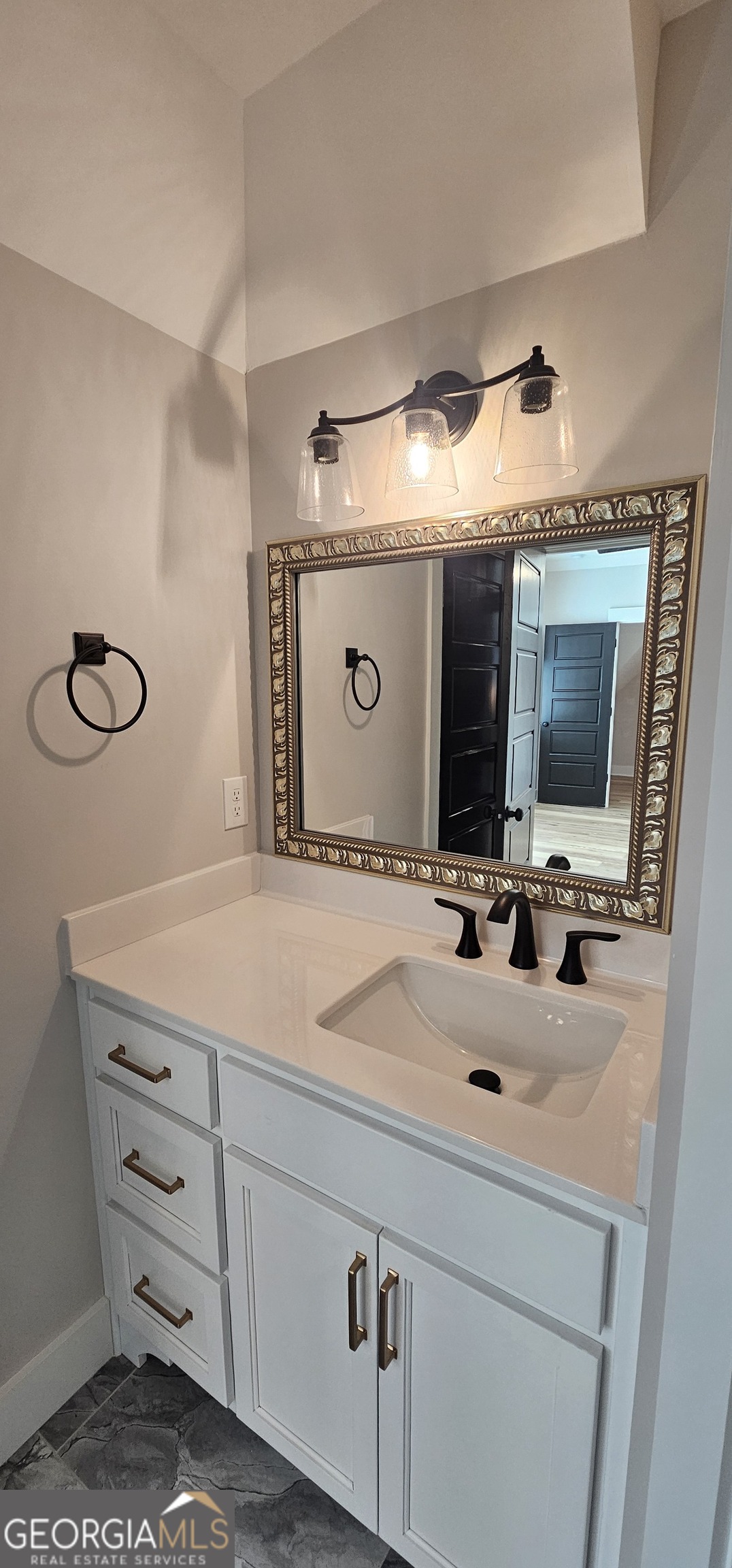 654 Liberty Hill Road Milner, GA 30257 - Photo 120 of 180 a bathroom with a sink and a mirror