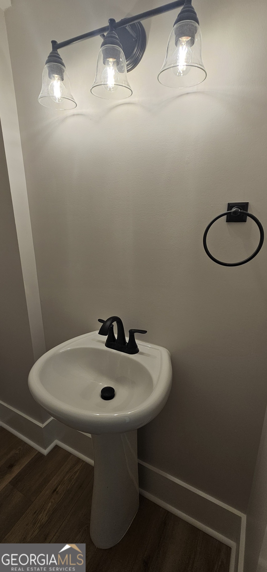 654 Liberty Hill Road Milner, GA 30257 - Photo 138 of 180 a bathroom with a sink and a mirror