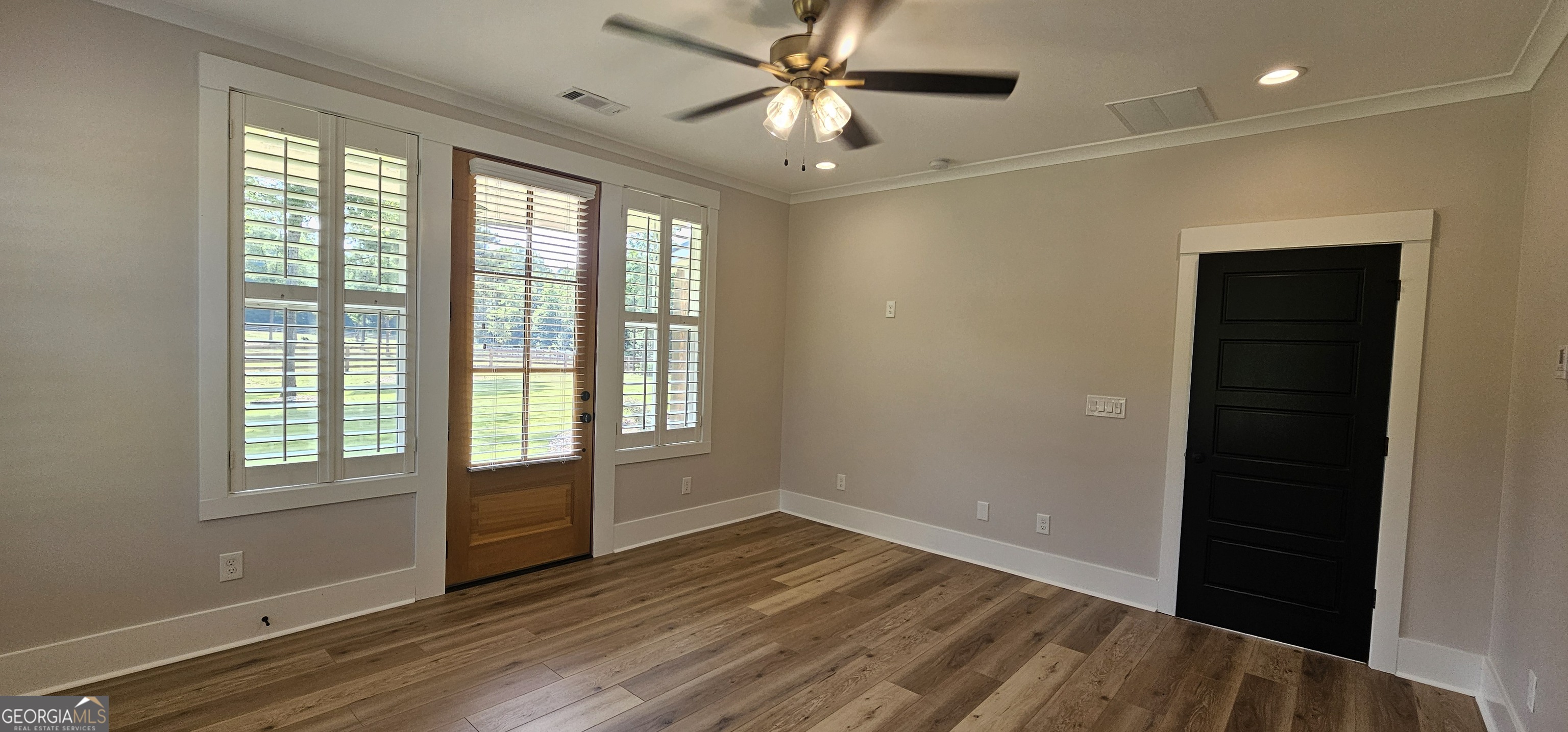 654 Liberty Hill Road Milner, GA 30257 - Photo 144 of 180 wooden floor in an empty room with a window