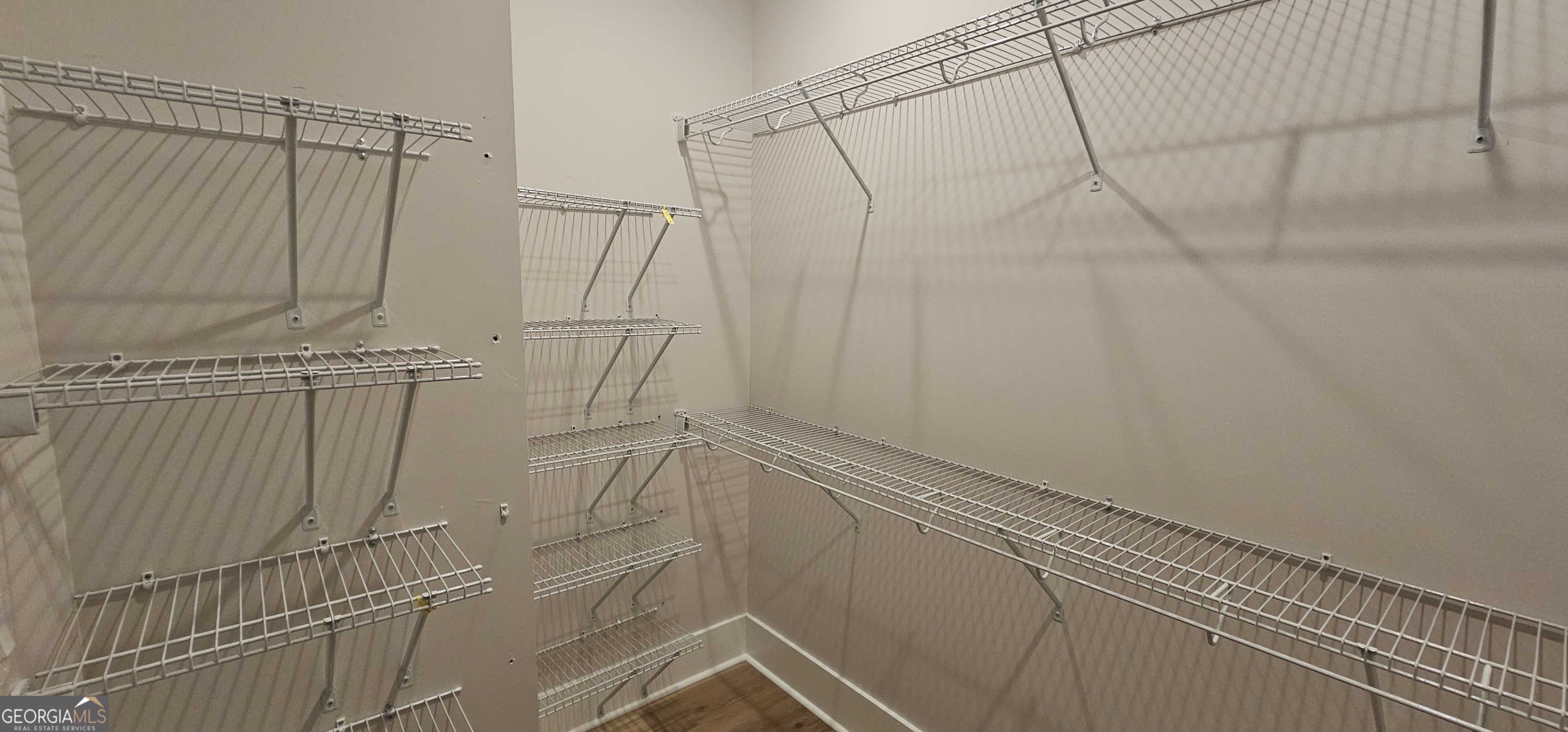 654 Liberty Hill Road Milner, GA 30257 - Photo 151 of 180 a view of a room with racks on the wall