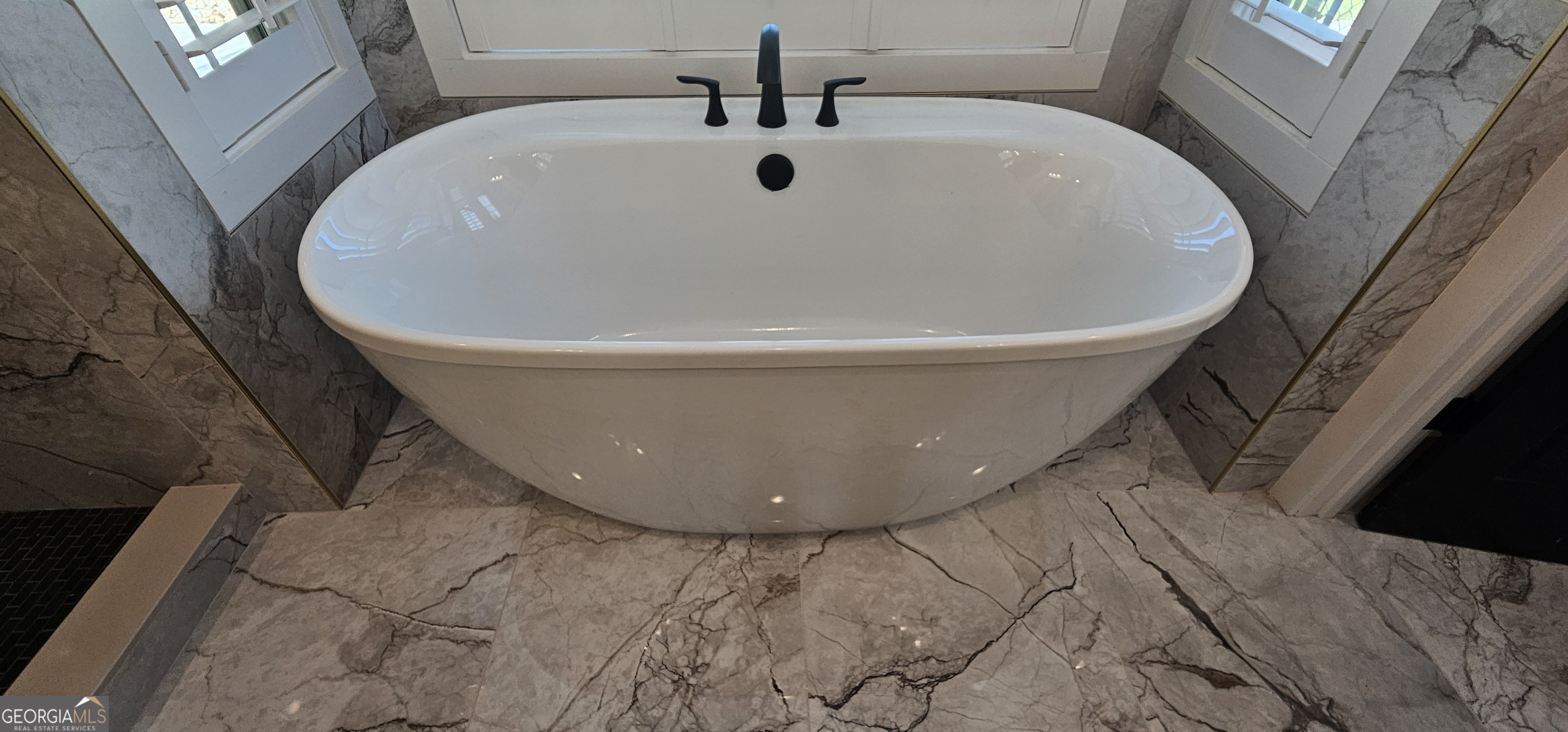 654 Liberty Hill Road Milner, GA 30257 - Photo 161 of 180 a white bath tub sitting in a bathroom