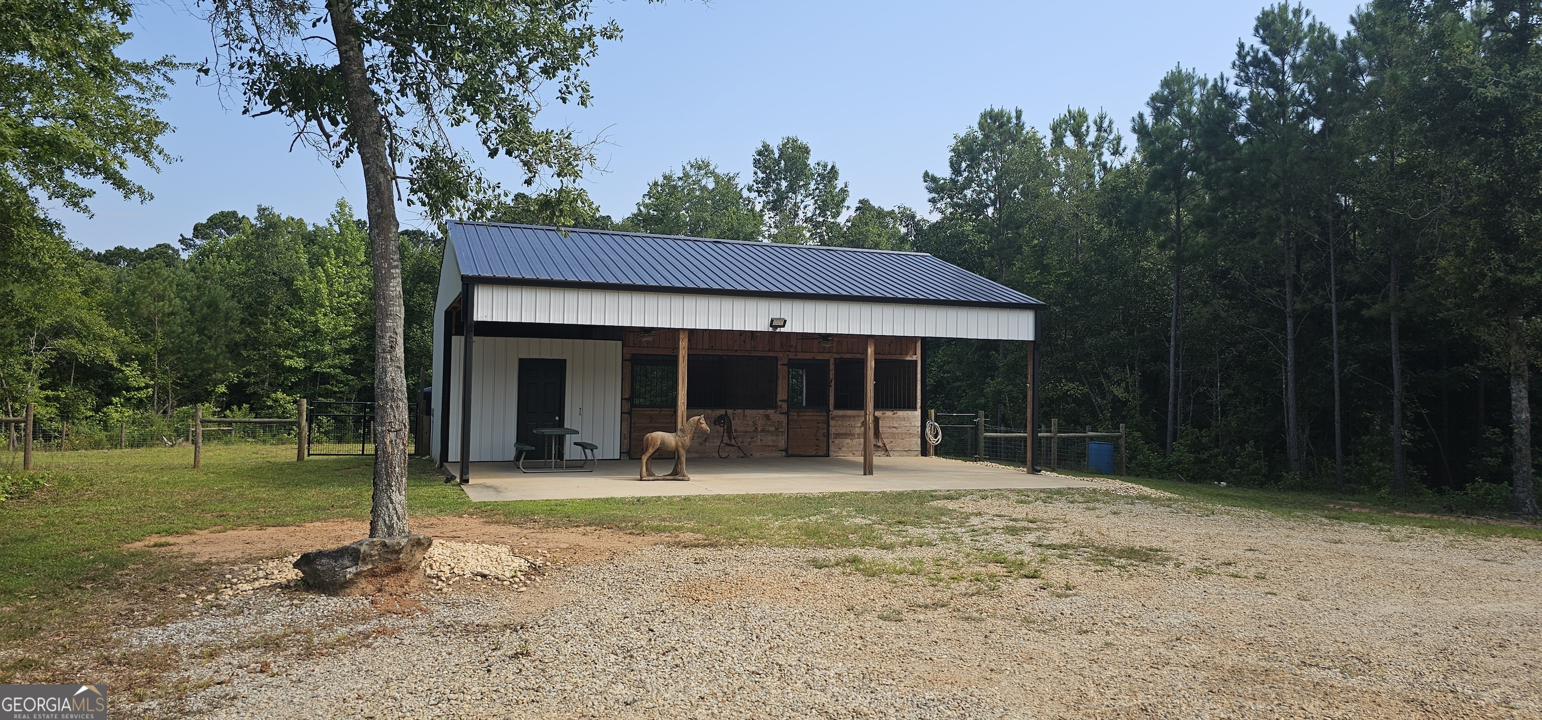 654 Liberty Hill Road Milner, GA 30257 - Photo 27 of 180 a front view of a house with a yard