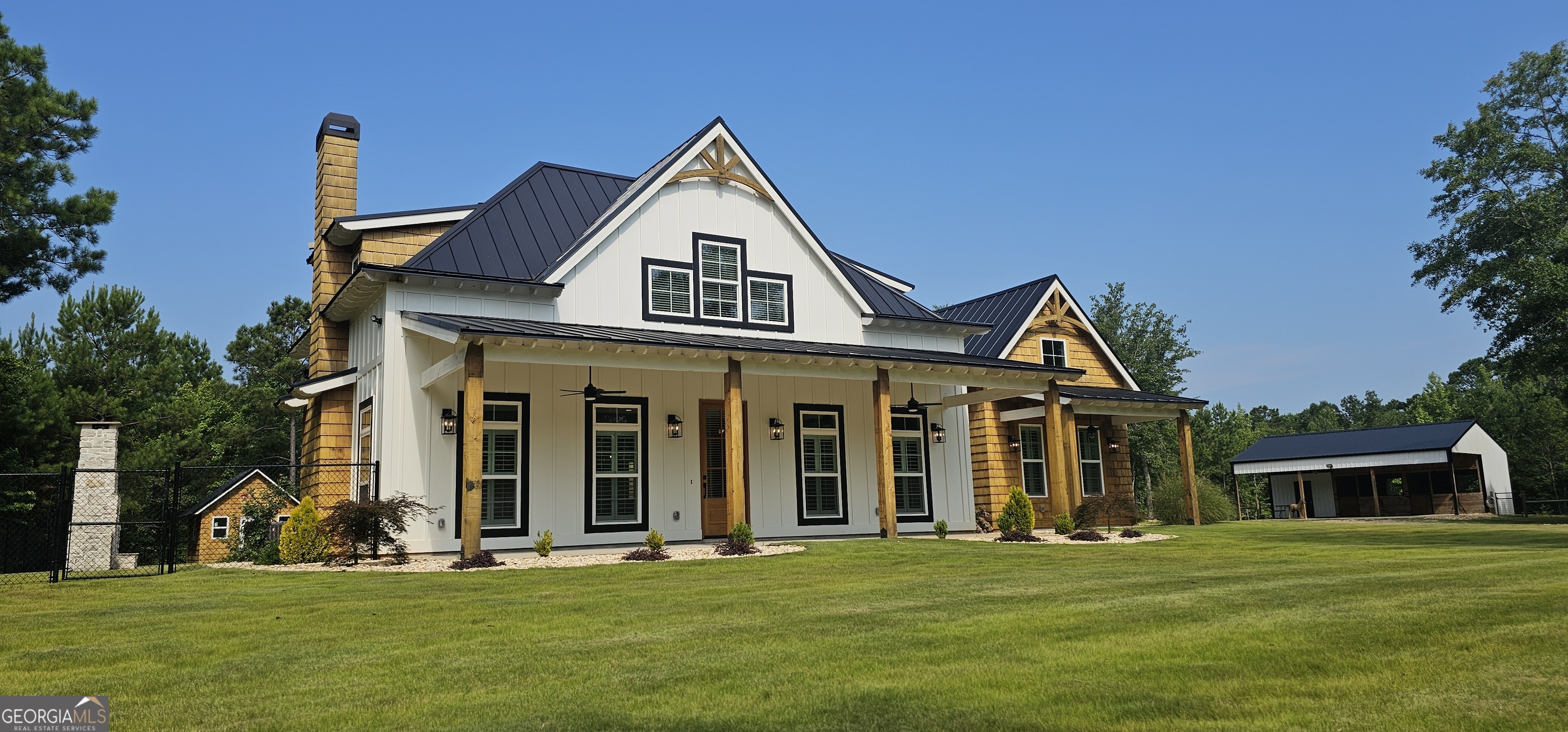654 Liberty Hill Road Milner, GA 30257 - Photo 3 of 180 a front view of a house with a garden