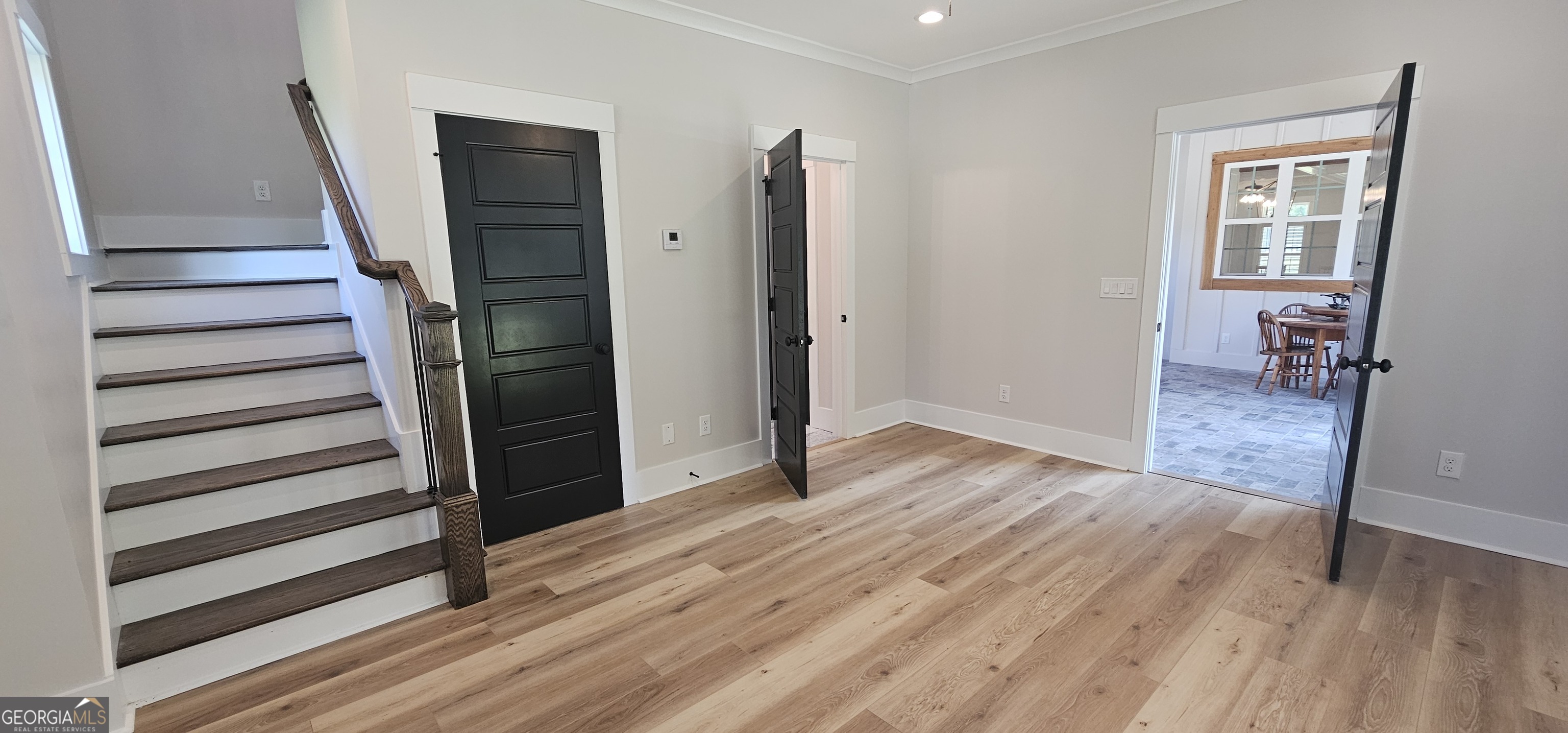 654 Liberty Hill Road Milner, GA 30257 - Photo 59 of 180 a view of a hallway with wooden floor and entryway