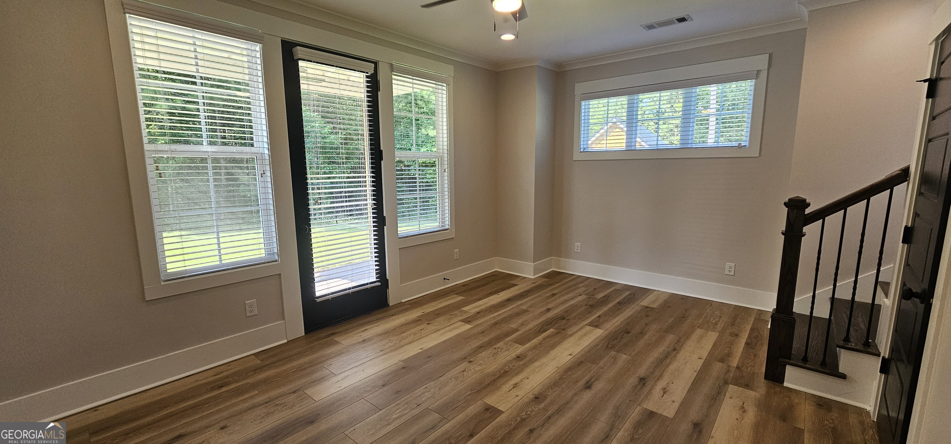 654 Liberty Hill Road Milner, GA 30257 - Photo 61 of 180 a view of an empty room with wooden floor and a window