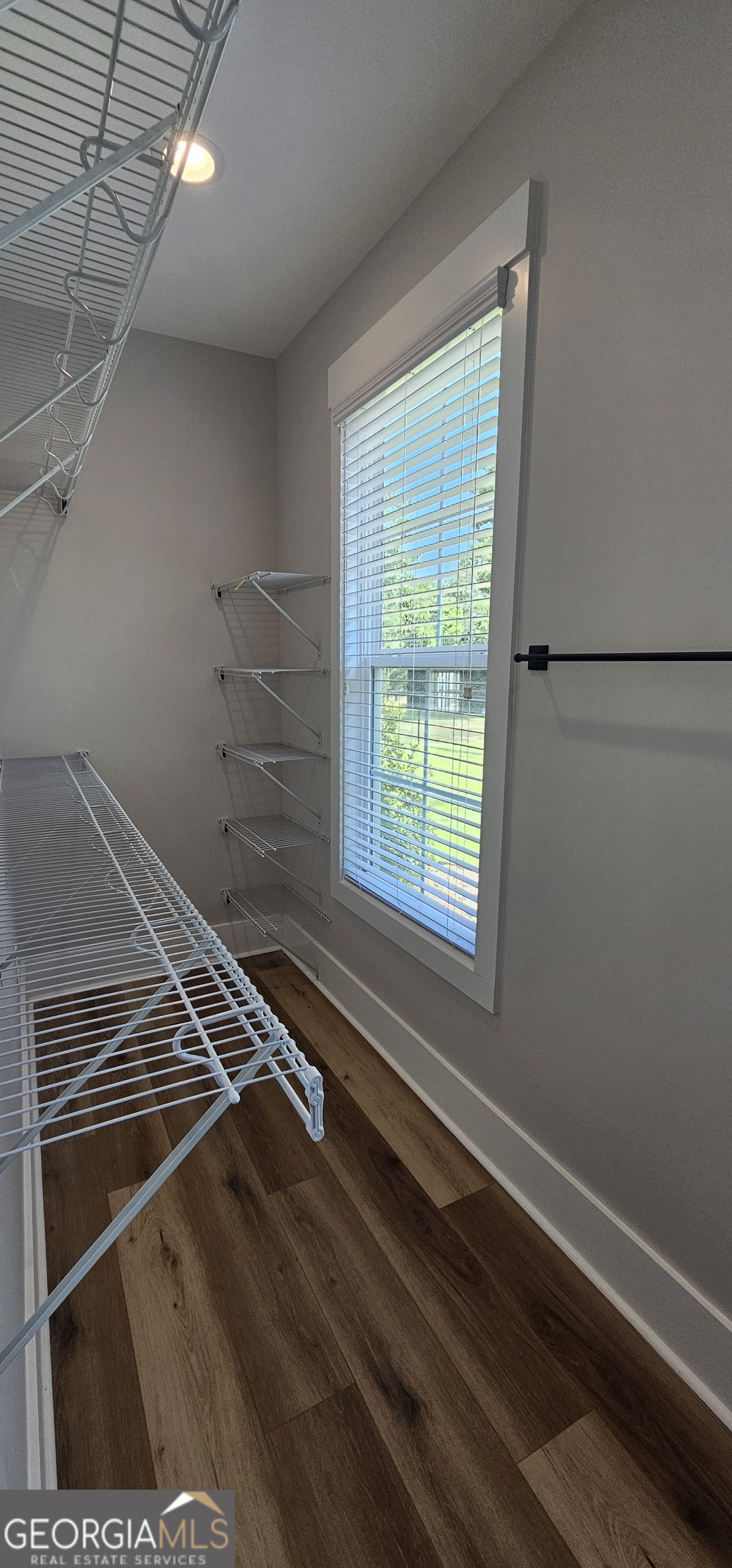 654 Liberty Hill Road Milner, GA 30257 - Photo 70 of 180 a view of a room with racks on the wall