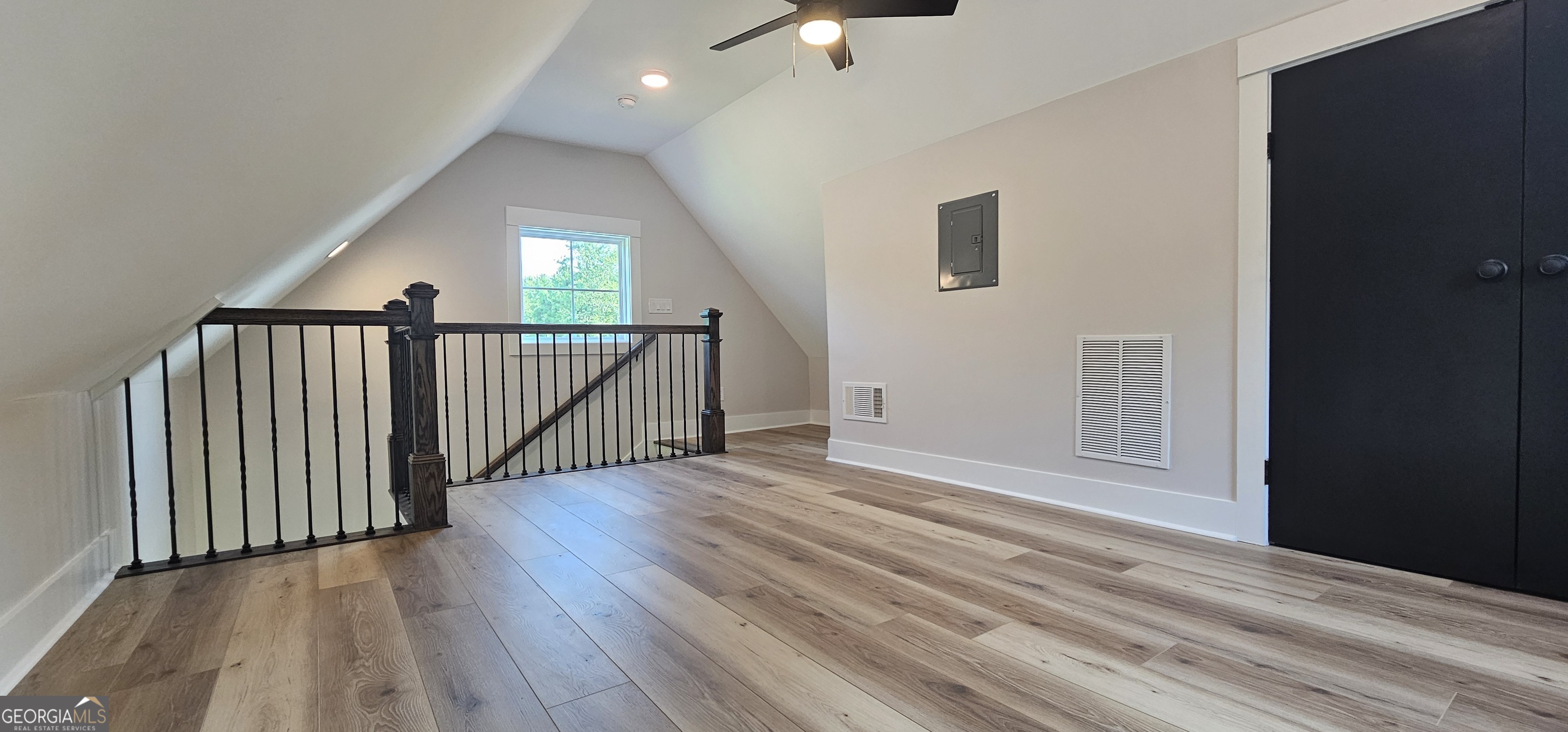 654 Liberty Hill Road Milner, GA 30257 - Photo 75 of 180 a view of a hallway with wooden floor and stairs