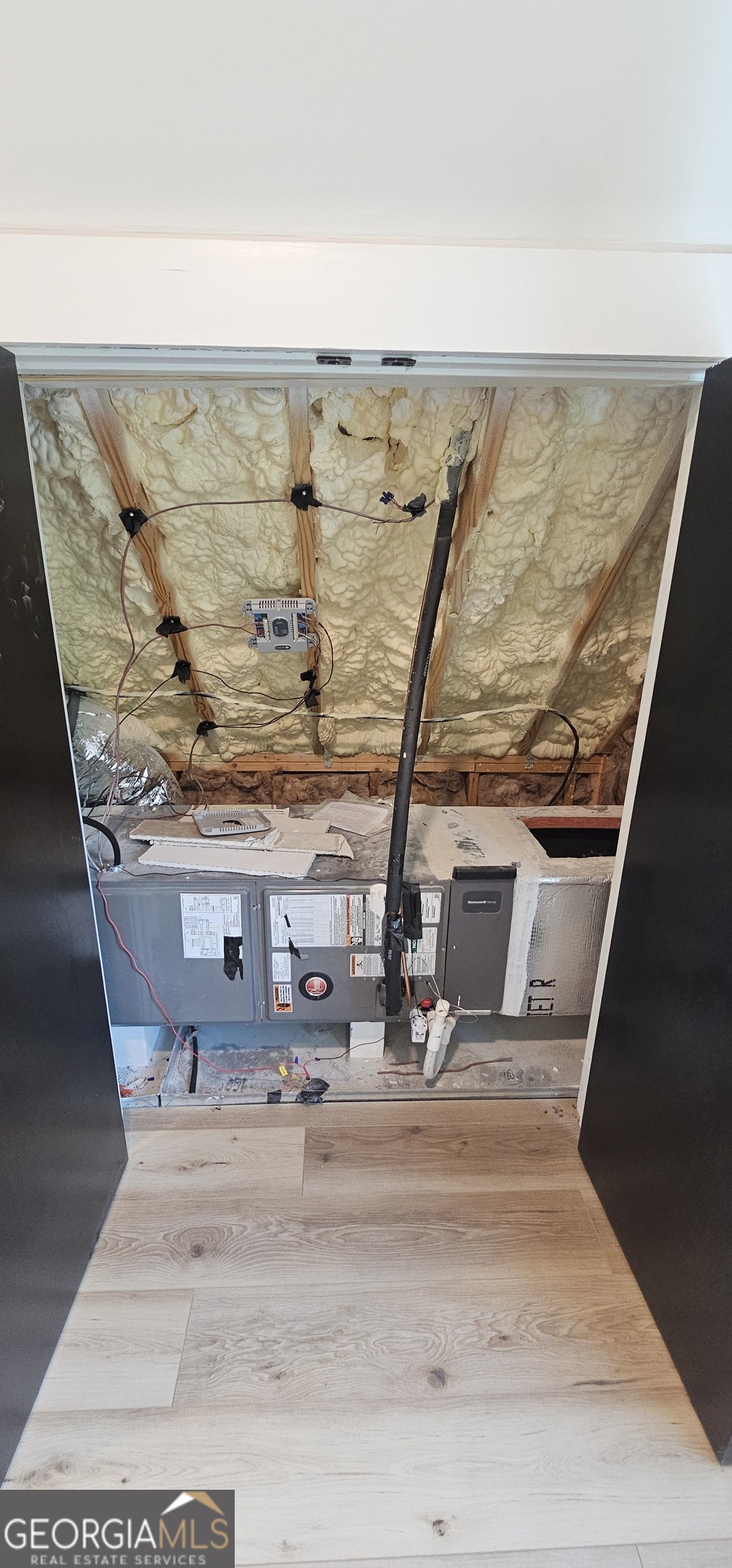 654 Liberty Hill Road Milner, GA 30257 - Photo 76 of 180 a view of water heater and living room view