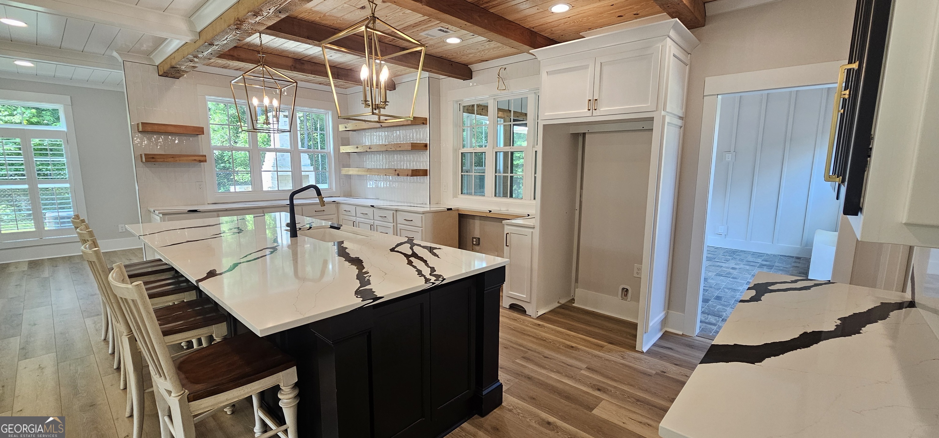 654 Liberty Hill Road Milner, GA 30257 - Photo 89 of 180 a view of a dining room with furniture window and wooden floor