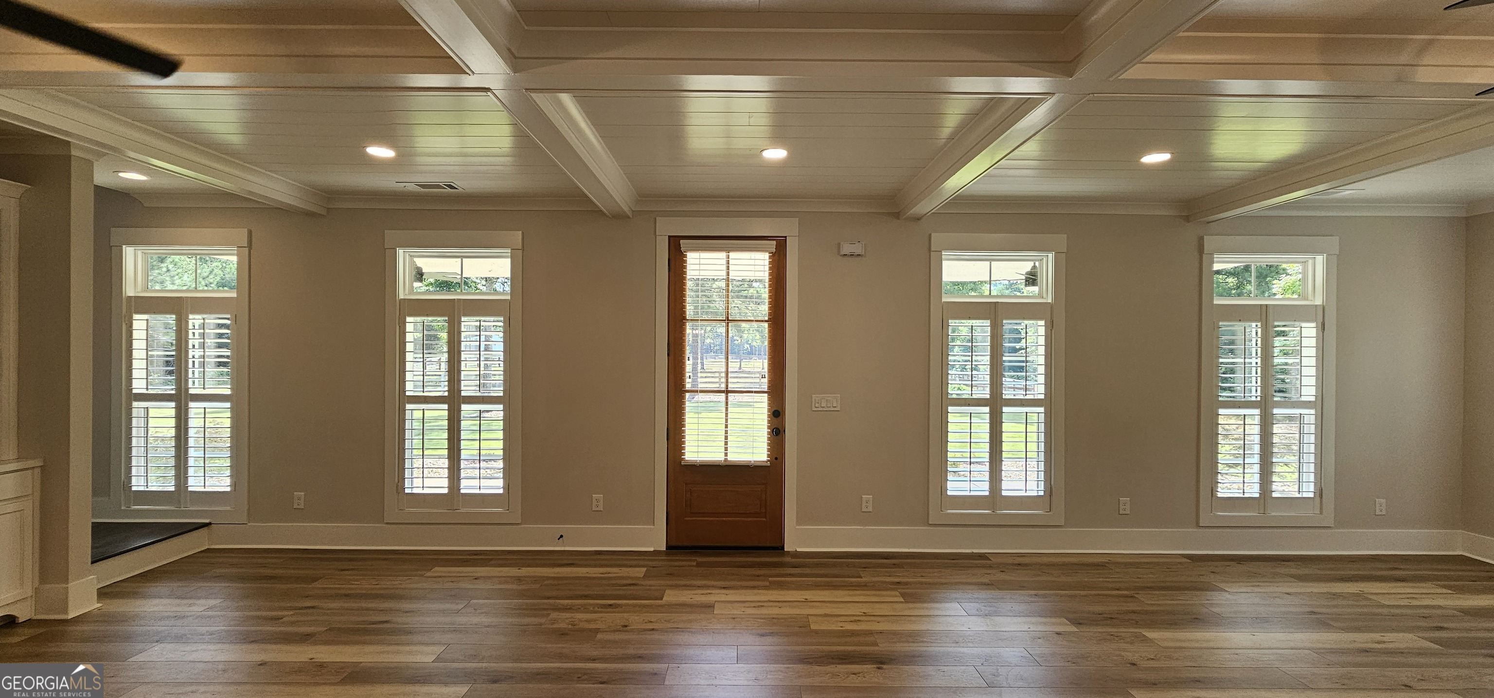 654 Liberty Hill Road Milner, GA 30257 - Photo 96 of 180 a view of an empty room with wooden floor and a window