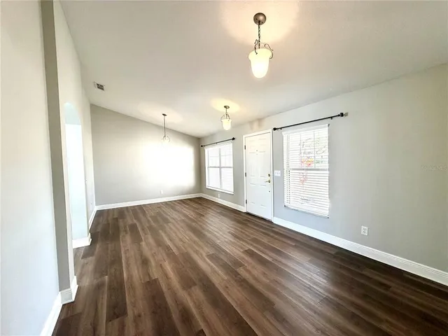 a view of an empty room with a window