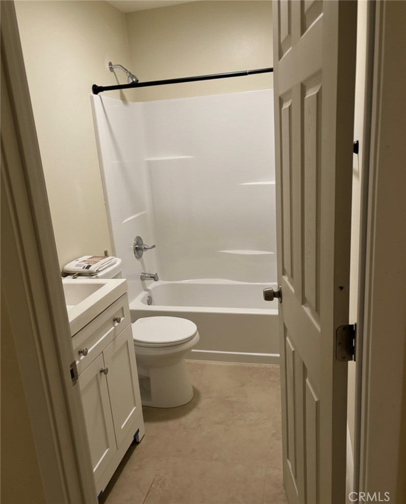 5604 Tower Road Riverside, CA 92506 - Photo 59 of 70 a bathroom with a granite countertop sink toilet and shower