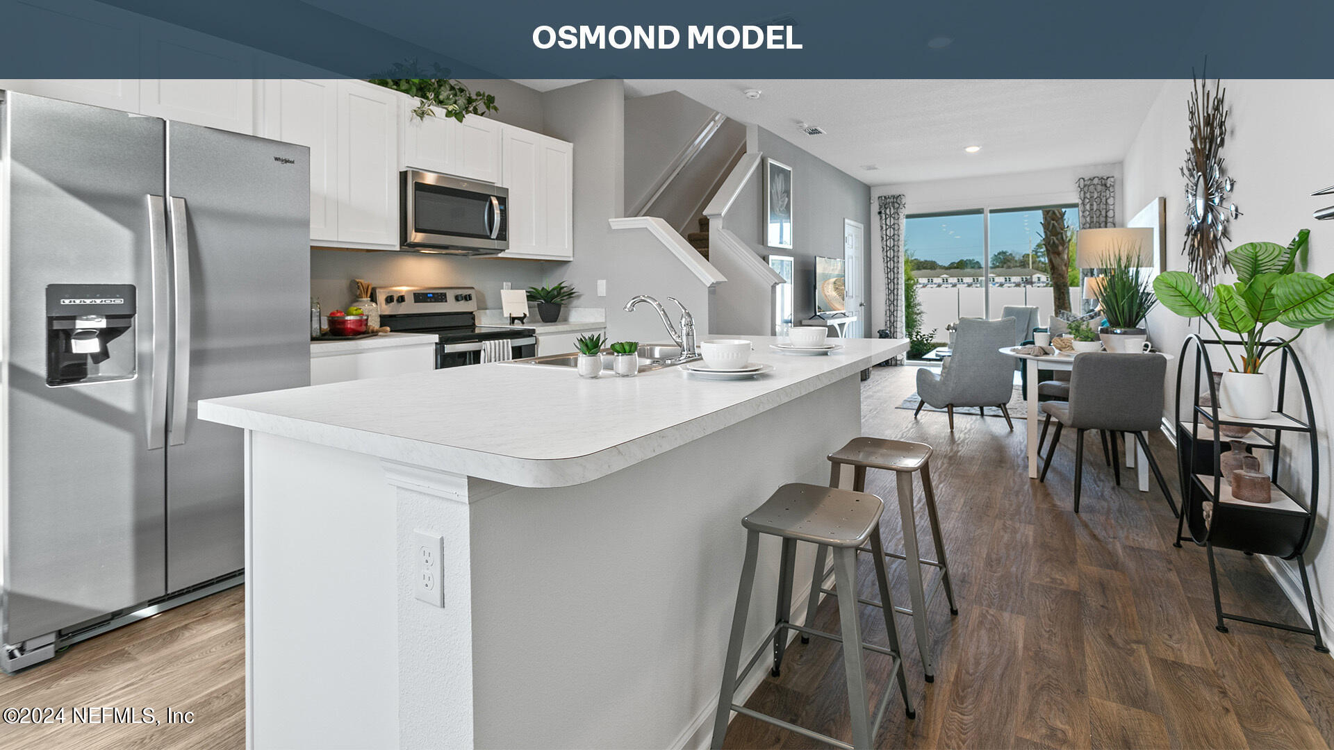 84 Vidalia Rdg Road St. Augustine, FL 32084 - Photo 6 of 32 a kitchen with a sink a microwave a refrigerator and chairs