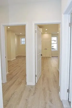 wooden floor with a bathroom