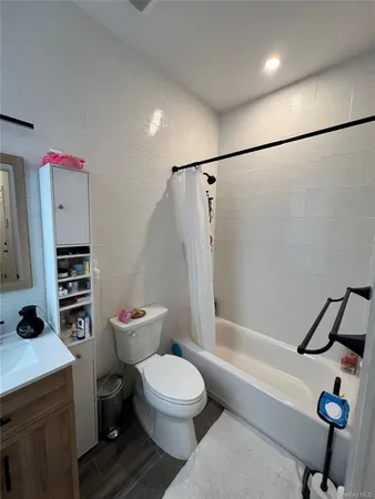 a bathroom with a toilet a sink and a shower