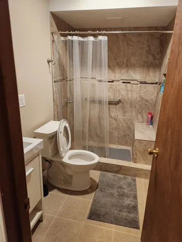 an aerial view of a house with a ocean view