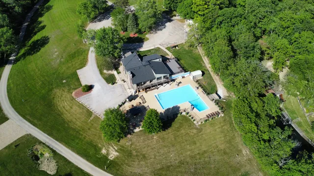 an aerial view of a house with a lake view