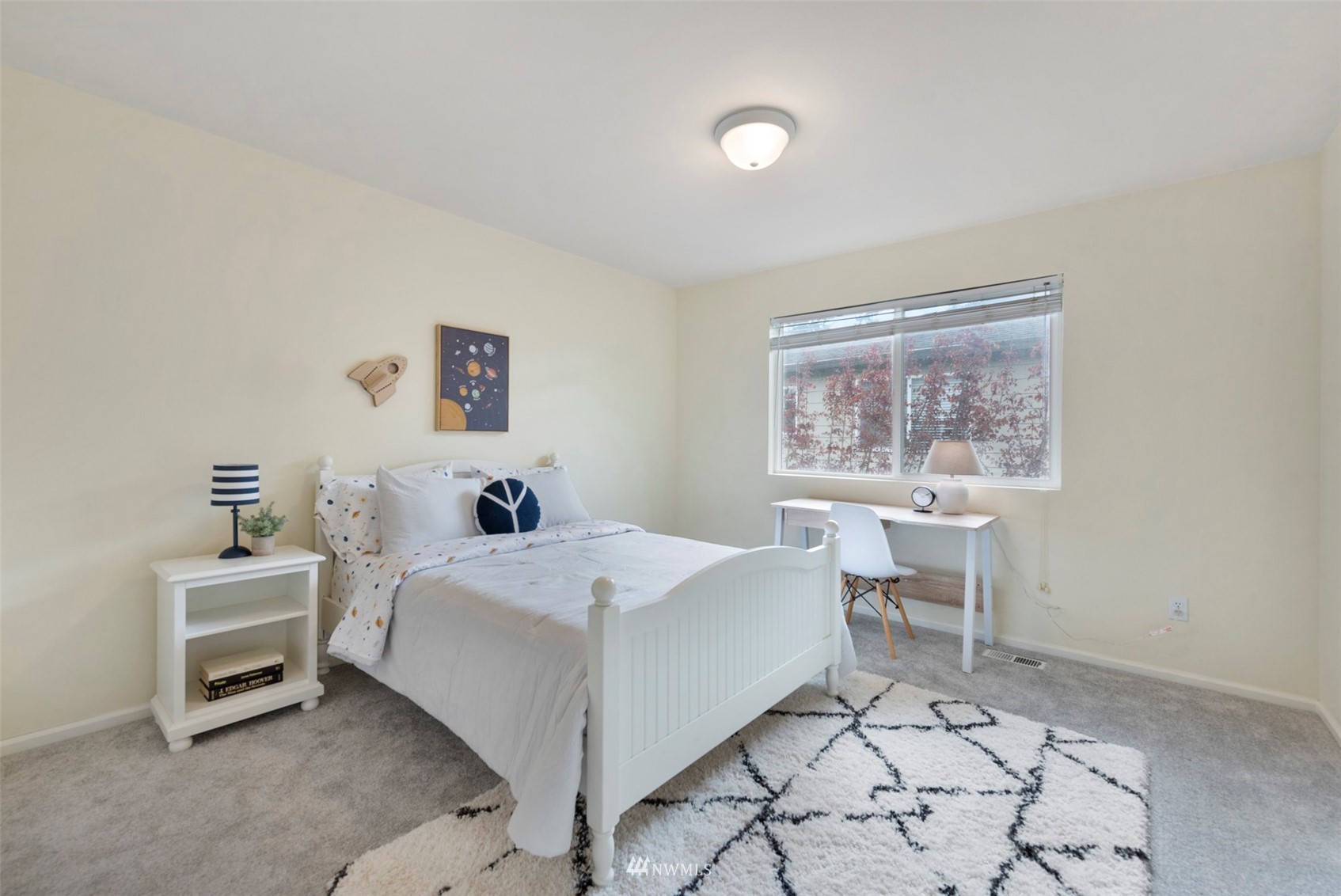 3306 175th Street Southeast Bothell, WA 98012 - Photo 23 of 31 a bedroom with a bed and a table in it