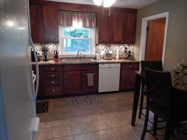 129 Talbot Road Springfield, MA 01119 - Photo 8 of 21 a kitchen with a sink window and cabinets