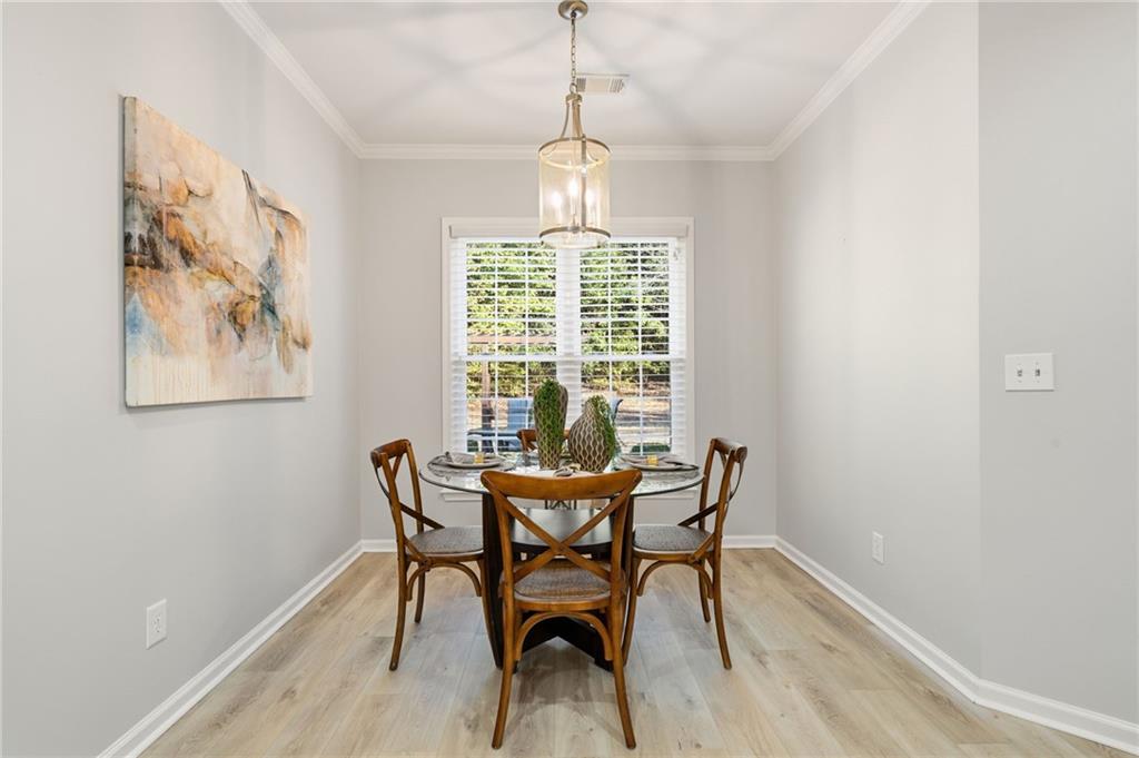 5090 Duke Drive Cumming, GA 30040 - Photo 24 of 65 a dining room with furniture and window