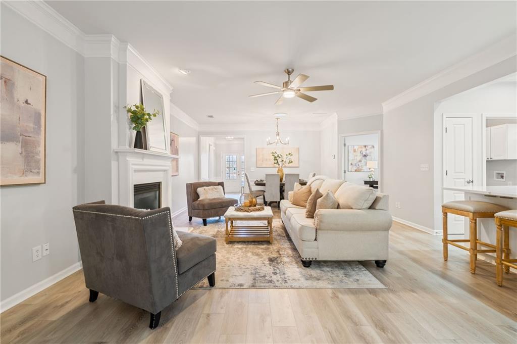 5090 Duke Drive Cumming, GA 30040 - Photo 28 of 65 a living room with furniture and a fireplace