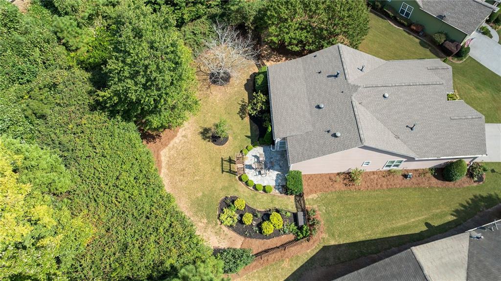 5090 Duke Drive Cumming, GA 30040 - Photo 3 of 65 an aerial view of a house with a swimming pool