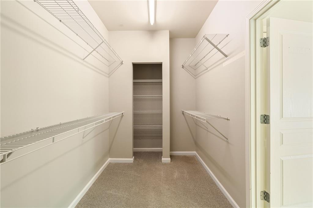 5090 Duke Drive Cumming, GA 30040 - Photo 43 of 65 a view of walk in closet